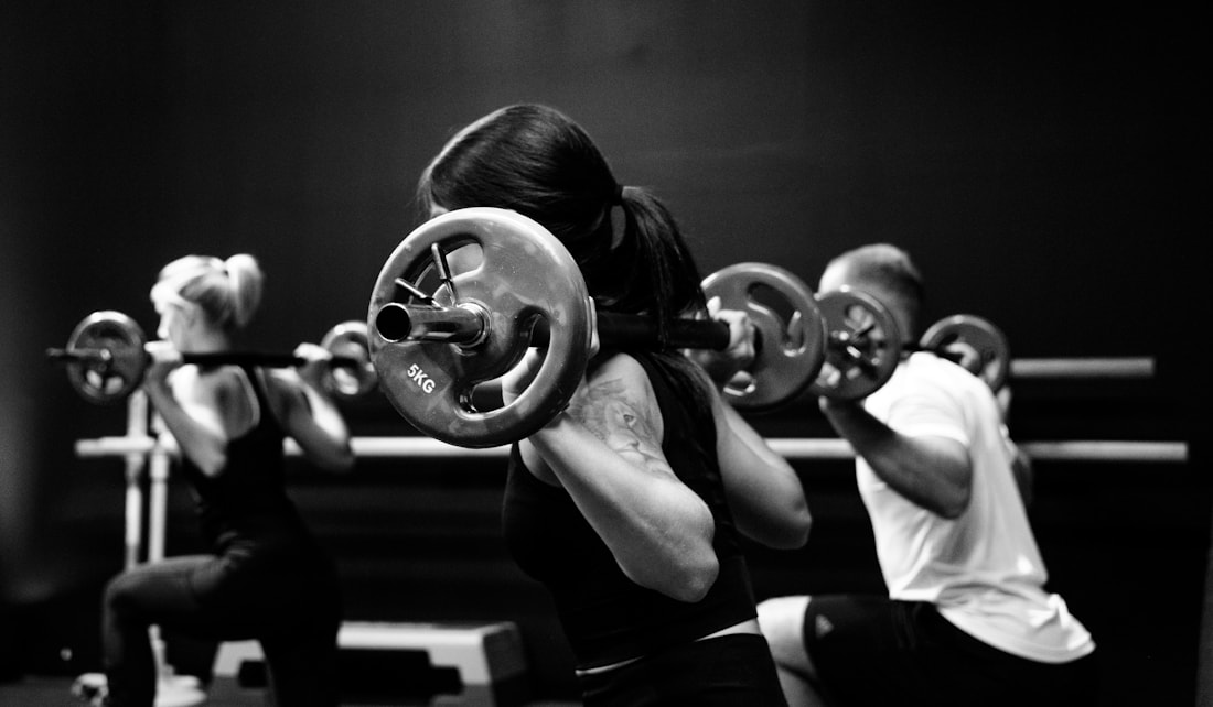 Hands gripping a barbell